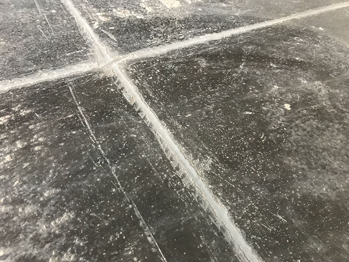 epoxy sealing at the intersection of joints in a concrete floor