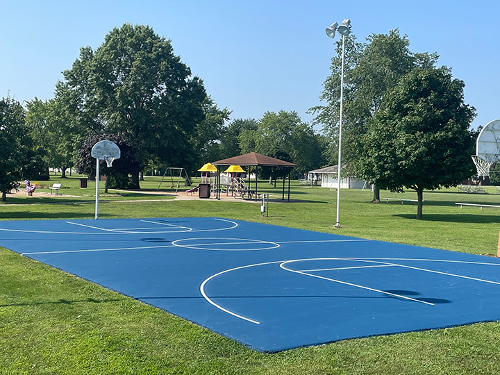 resurfaced blue outside basketball court