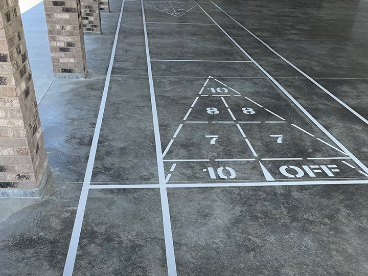 shuffle board lines painted on to a concrete surface