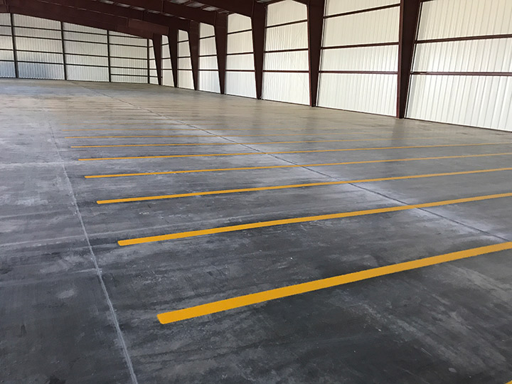 striping on a concrete floor in the interior of a building