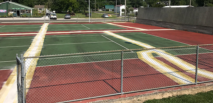 asphalt surface in the process of having cracks sealed