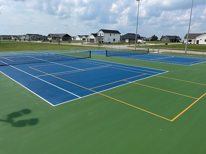 resurfaced blue tennis and pickle ball courts